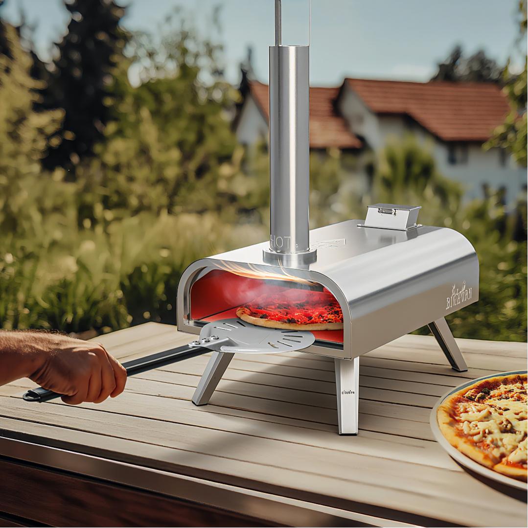 Pizza being removed from a stainless steel outdoor oven with a pizza peel