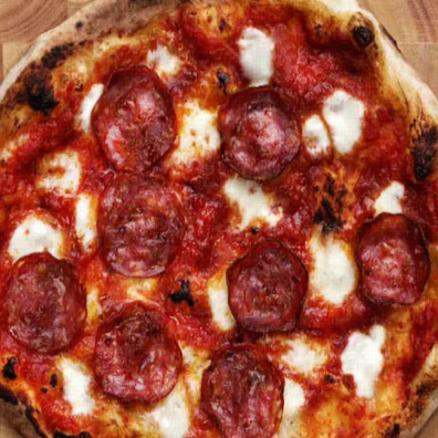 A close-up of a freshly baked pepperoni pizza.
