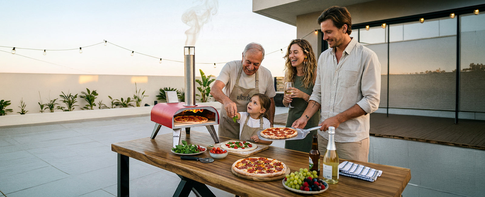 Family enjoying pizza and drinks on a rooftop patio with a pizza oven.