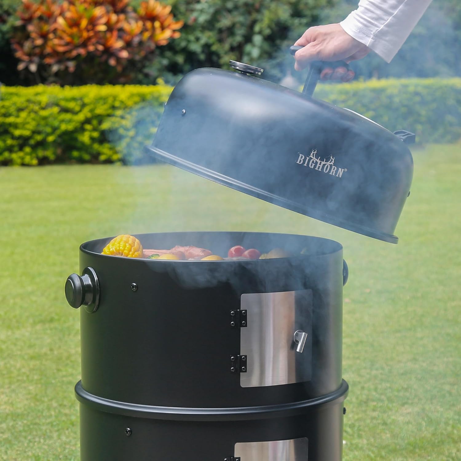 Big Horn Outdoors 16" charcoal smoker, open lid showing food being smoked or grilled