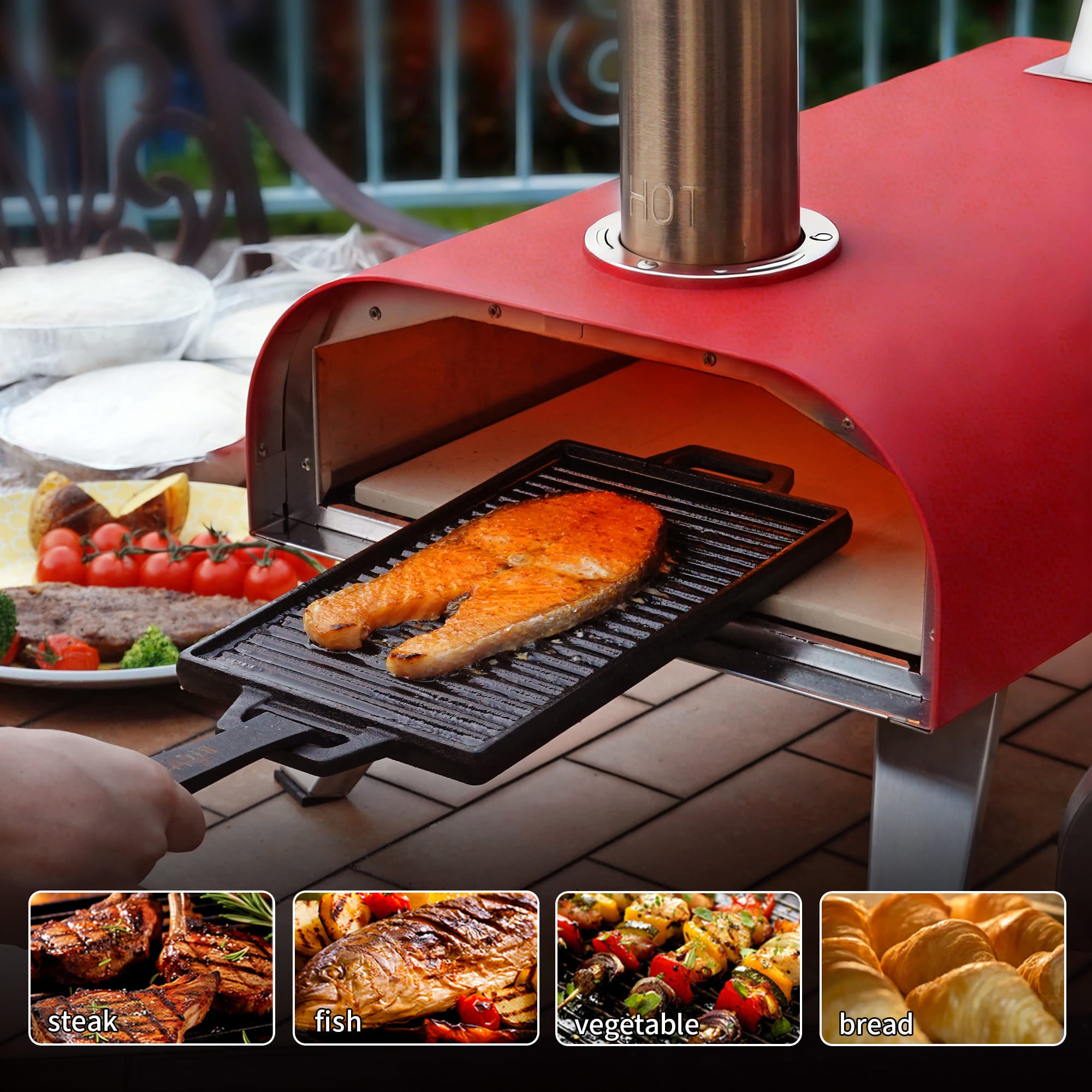 Red outdoor pizza oven with salmon on a grill, surrounded by food items.