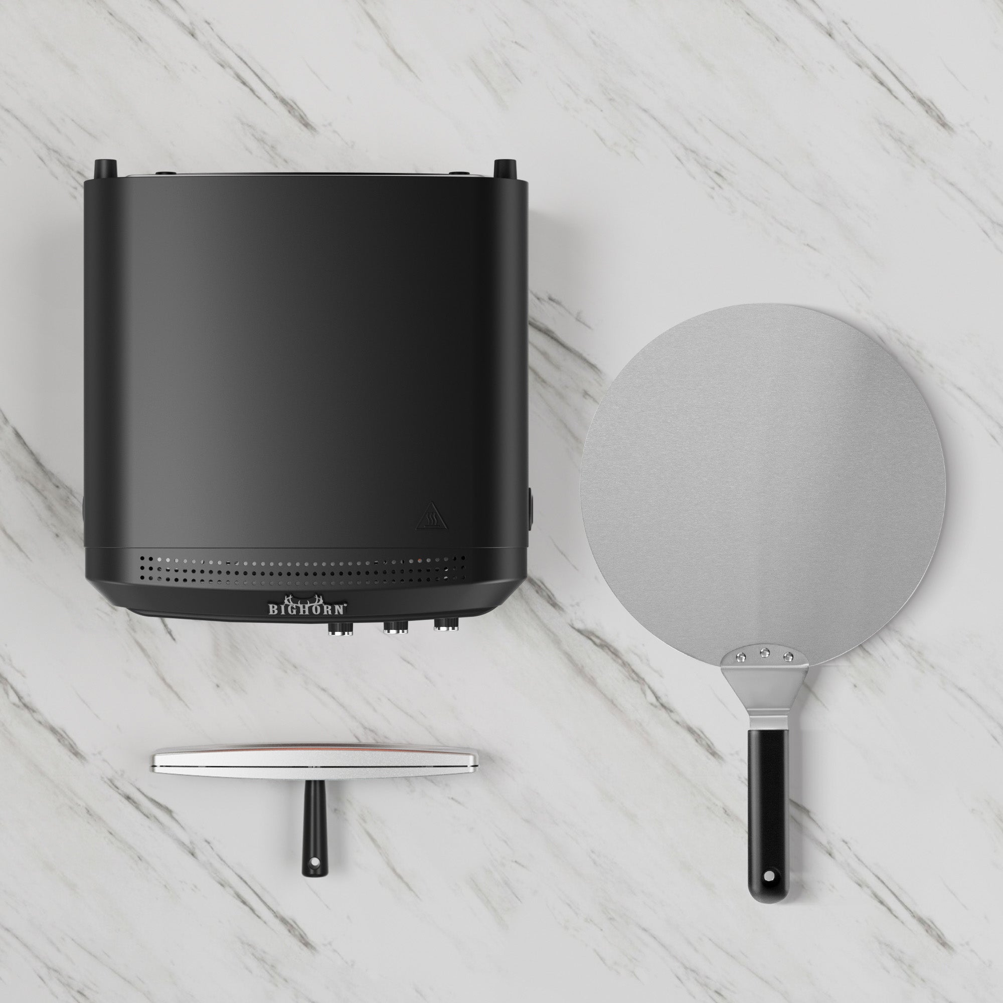 Black Big Horn countertop pizza oven with pizza peel and cutter on marble surface, 14 inch pizza maker