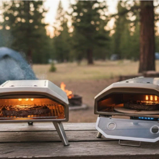 Two portable outdoor pizza ovens at campsite