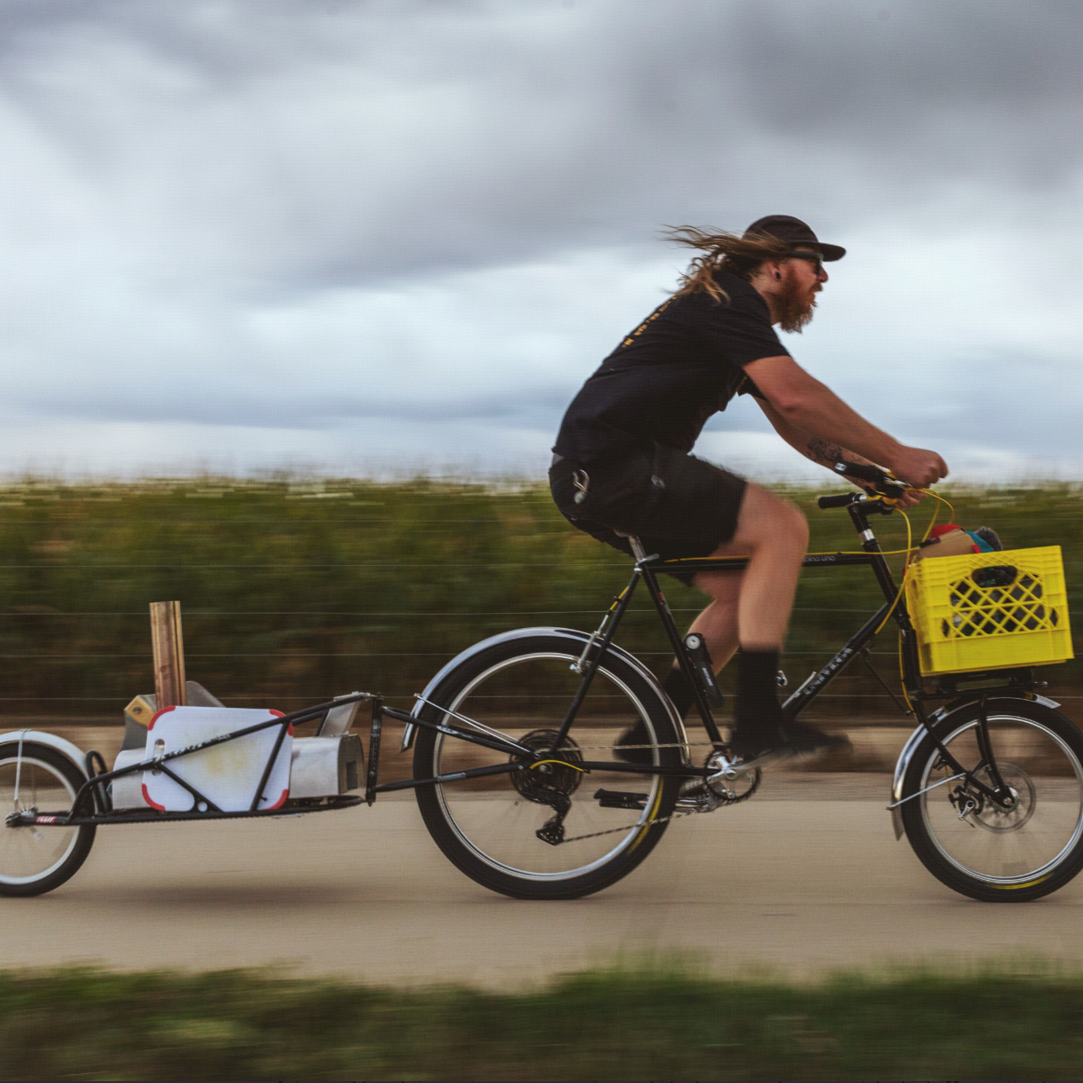 Biking with a portable pizza oven trailer for camping