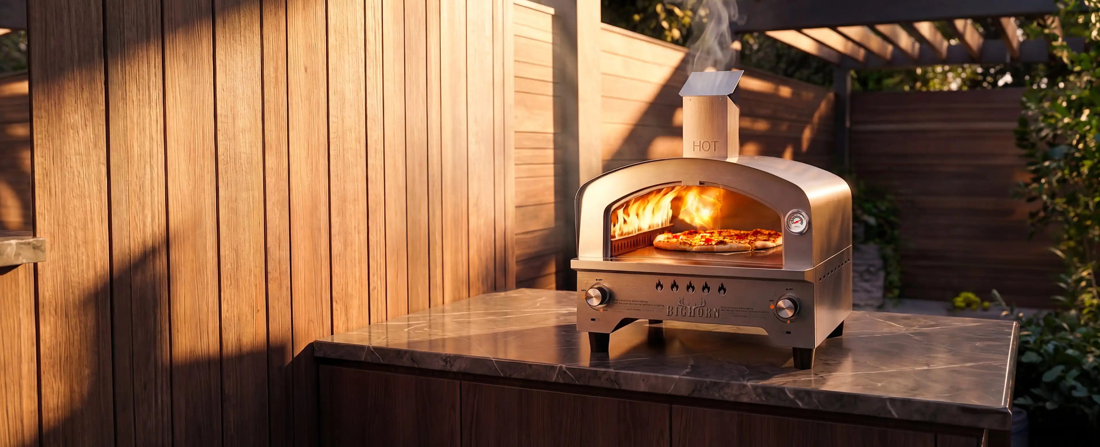Outdoor pizza oven with fire inside, mounted on a wooden wall.
