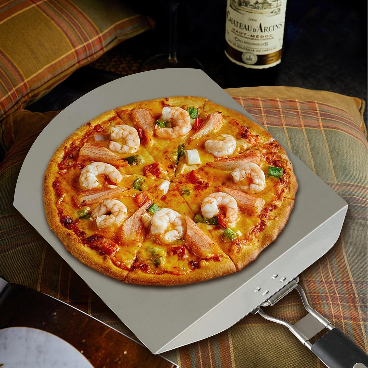 Shrimp pizza on stainless steel pizza peel, perfect for homemade pizza nights.
